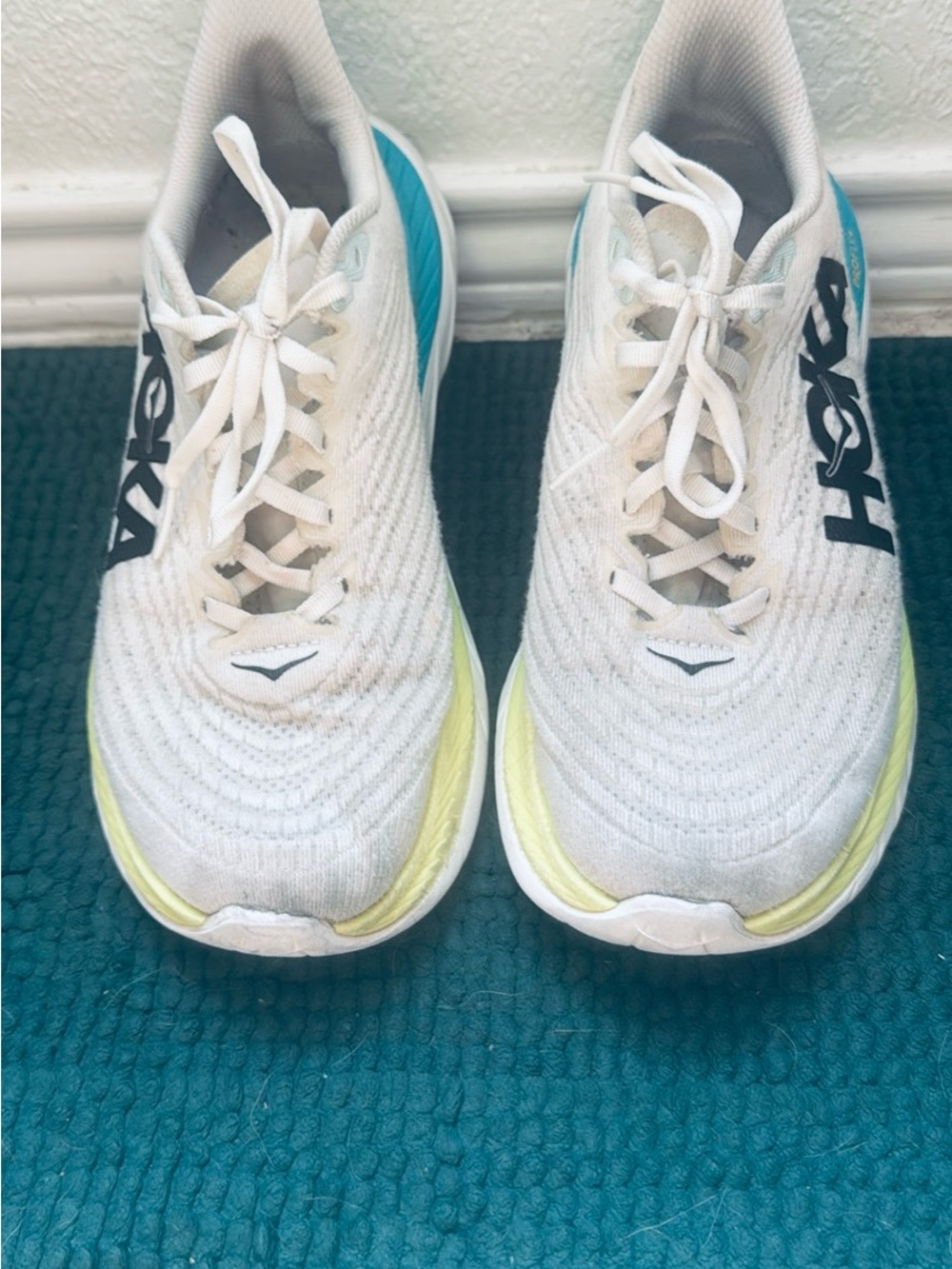 Hoka White Athletic Shoes with Yellow and Blue Accents